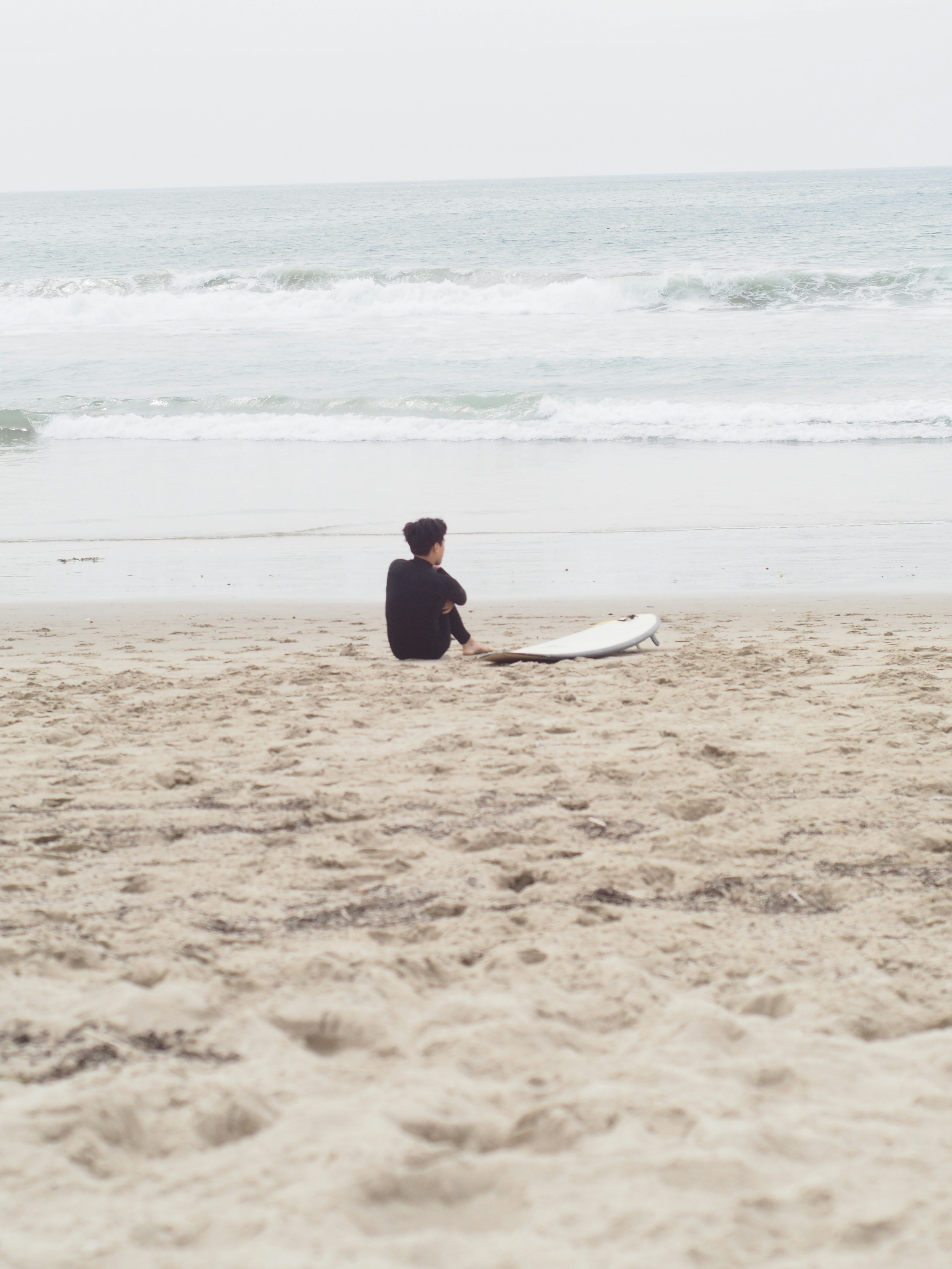 Guys are filming some girls on the beach